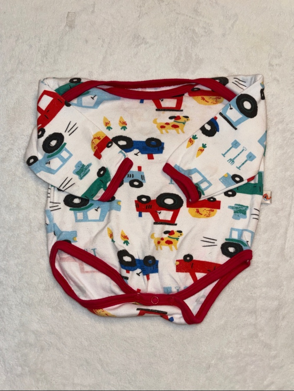 (3 for $10) bumzee Colorful Tractor Print Baby Onesie with Red Trim